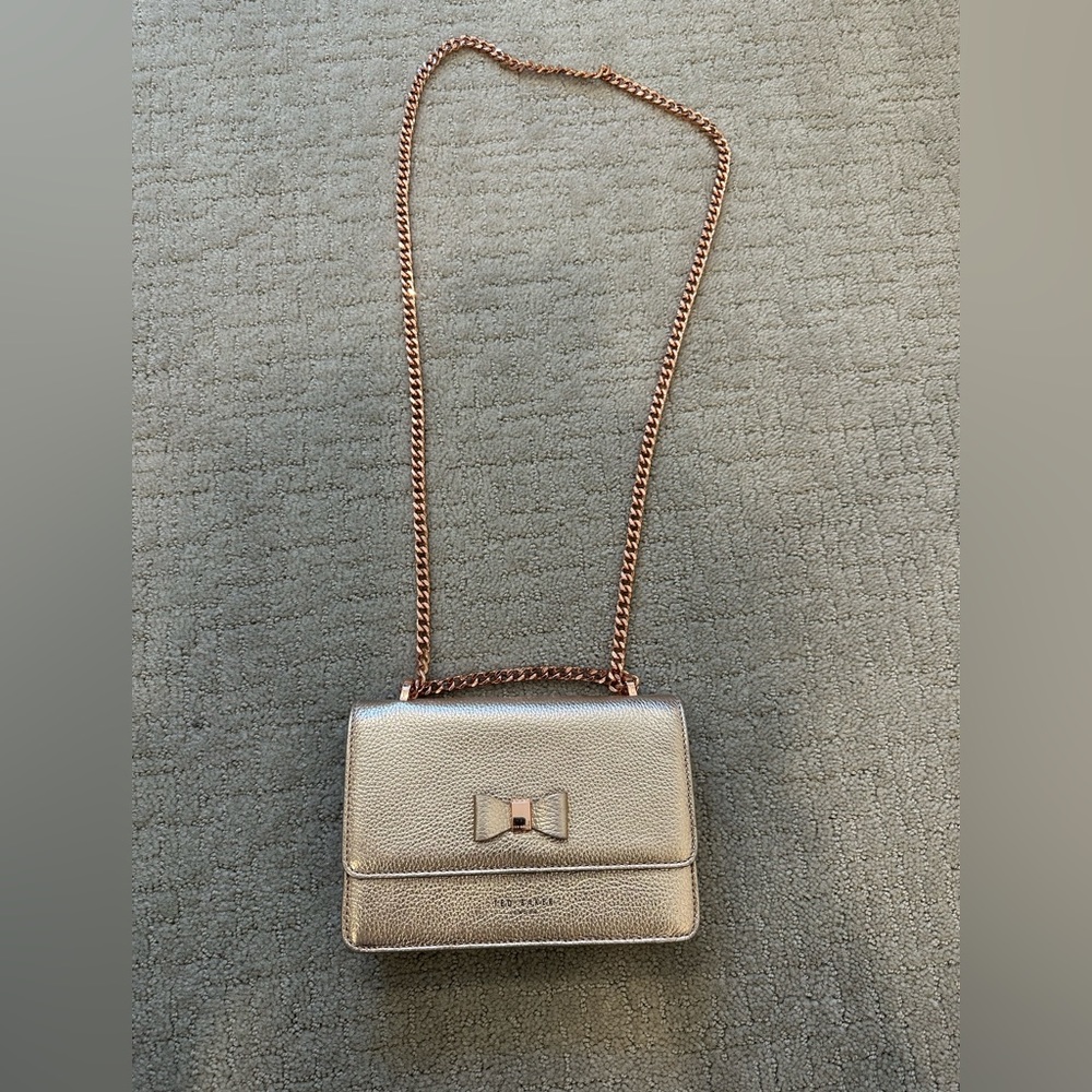 Ted Baker London rose gold crossbody bag.